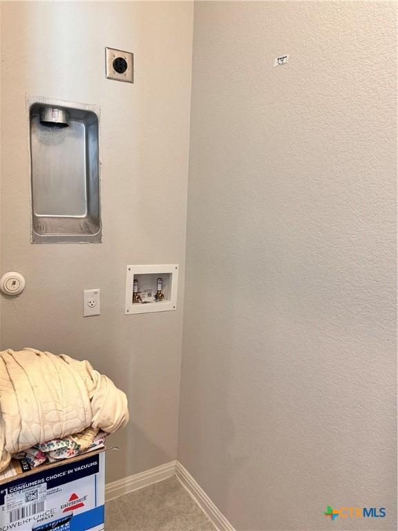 137 Rustic Glen Dr, San Marcos, TX 78666 - clothes washing area with hookup for an electric dryer, baseboards, and washer hookup