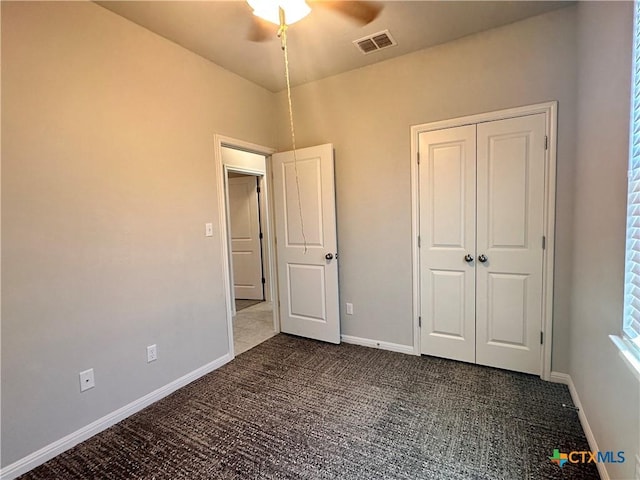 137 Rustic Glen Dr, San Marcos, TX 78666 - unfurnished bedroom featuring carpet floors, baseboards, a closet, and a ceiling fan
