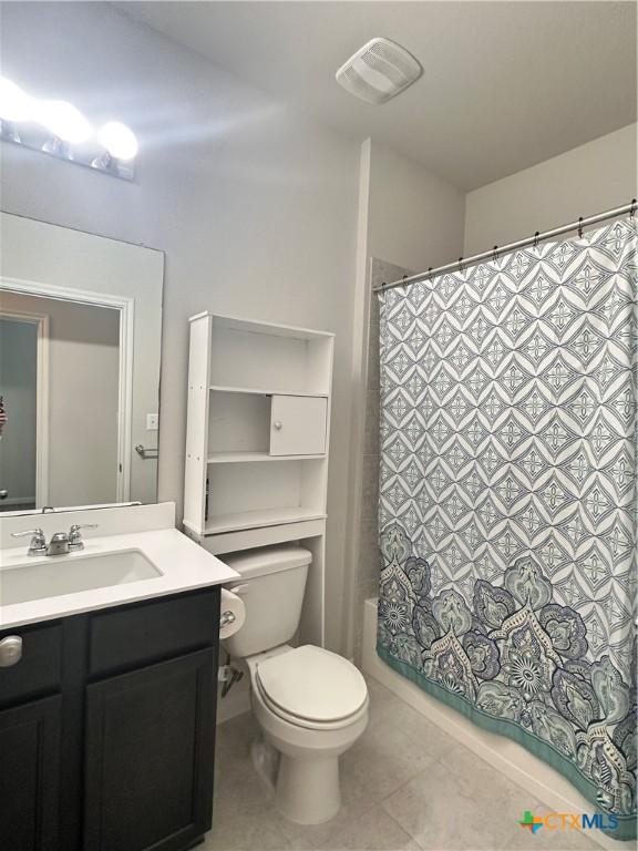 137 Rustic Glen Dr, San Marcos, TX 78666 - bathroom featuring tile patterned floors, toilet, and vanity