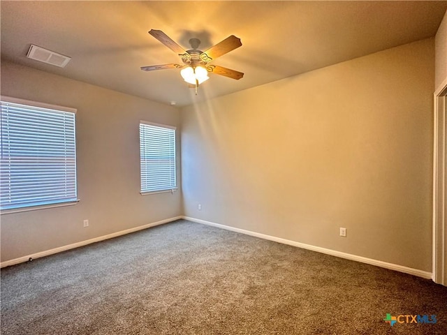 137 Rustic Glen Dr, San Marcos, TX 78666 - carpeted spare room with baseboards and ceiling fan