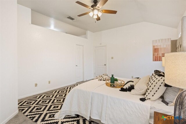 4402 Frontier Trl, Killeen, TX 76542 - carpeted bedroom with baseboards, vaulted ceiling, visible vents, and ceiling fan