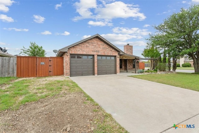 4402 Frontier Trl, Killeen, TX 76542 - ranch-style home with a gate, driveway, fence, brick siding, and an attached garage