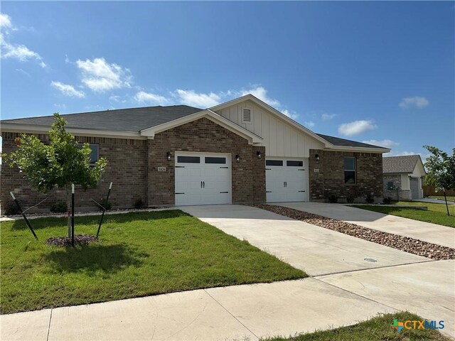 5108 Rose Petal Ct, Killeen, TX 76542 - ranch-style home featuring brick siding, an attached garage, a front yard, and driveway