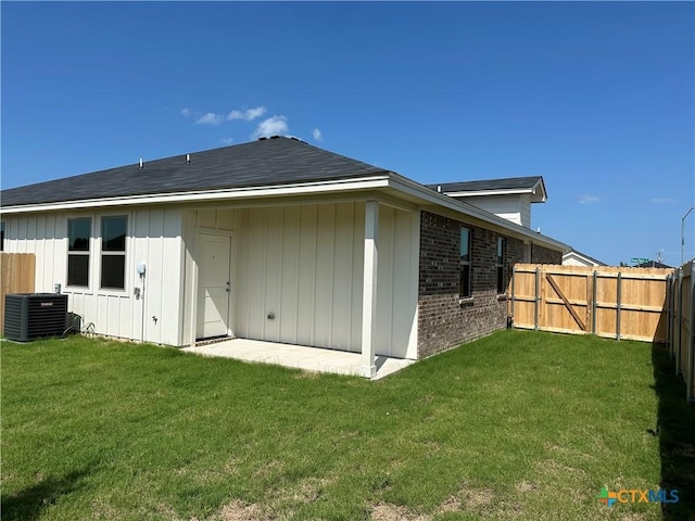 5108 Rose Petal Ct, Killeen, TX 76542 - rear view of house featuring a fenced backyard, brick siding, and board and batten siding