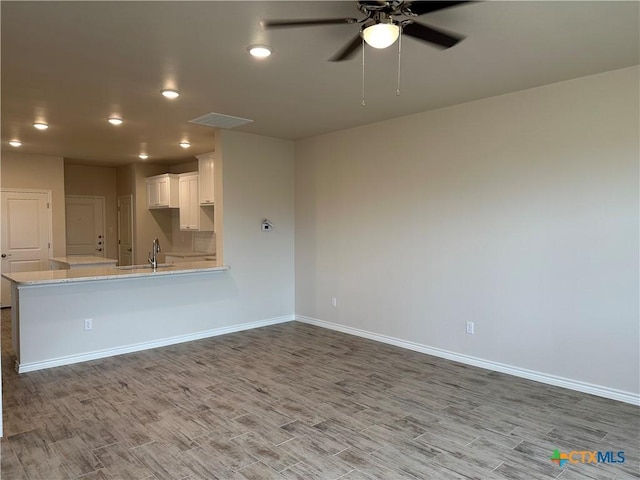 5108 Rose Petal Ct, Killeen, TX 76542 - unfurnished living room with wood finished floors, ceiling fan, and recessed lighting