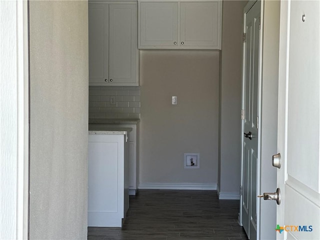 5108 Rose Petal Ct, Killeen, TX 76542 - laundry area featuring baseboards and dark wood-type flooring