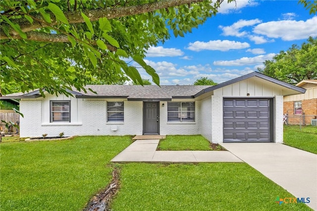 1008 Ronstan Dr, Killeen, TX 76542 - ranch-style house featuring brick siding, driveway, an attached garage, board and batten siding, and roof with shingles