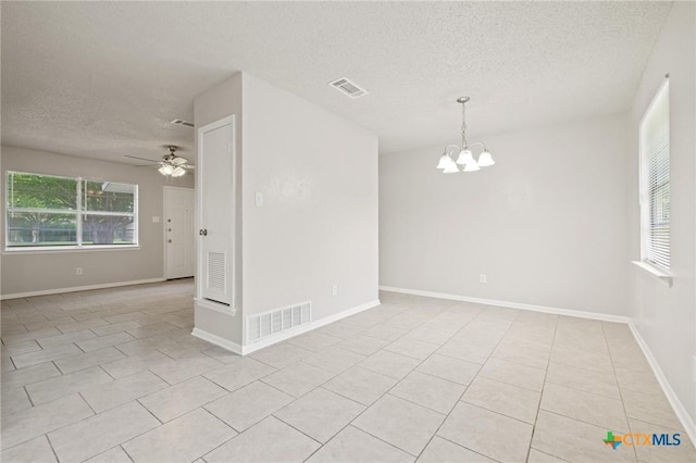 1008 Ronstan Dr, Killeen, TX 76542 - unfurnished room with a textured ceiling, a chandelier, light tile patterned floors, a ceiling fan, and baseboards