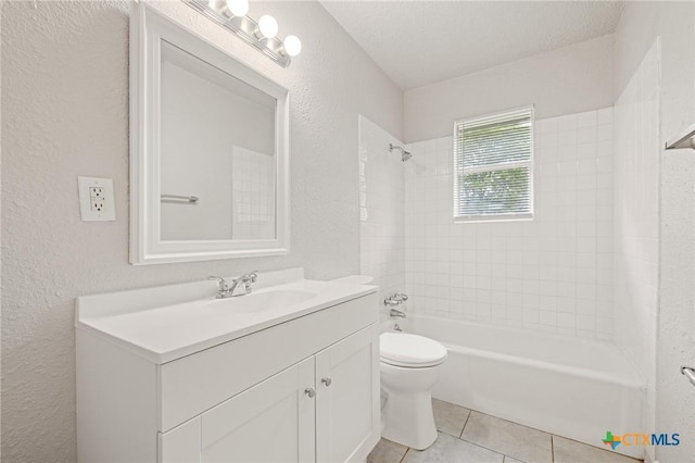 1008 Ronstan Dr, Killeen, TX 76542 - full bath featuring a textured wall, toilet, vanity, shower / washtub combination, and tile patterned floors