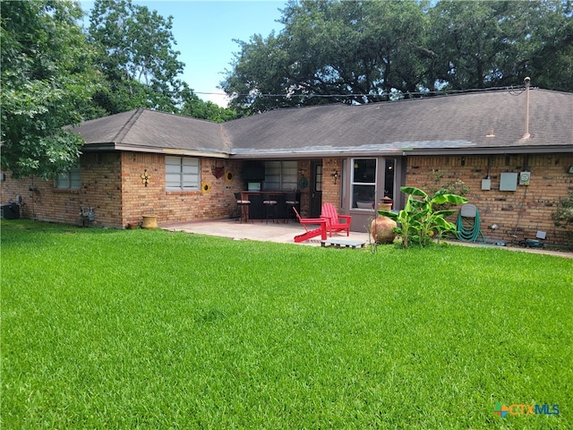 rear view of house featuring central AC, a patio area, and a yard