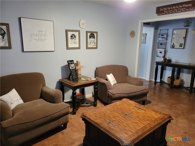 living room with tile patterned floors