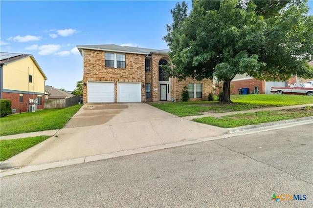 view of front of home featuring a garage and a front lawn