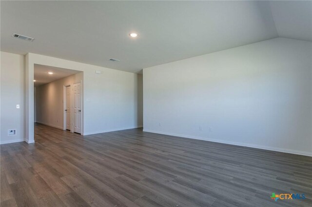 3820 Poteet Ct, Temple, TX 76504 - unfurnished room with dark wood-style flooring, vaulted ceiling, baseboards, visible vents, and recessed lighting