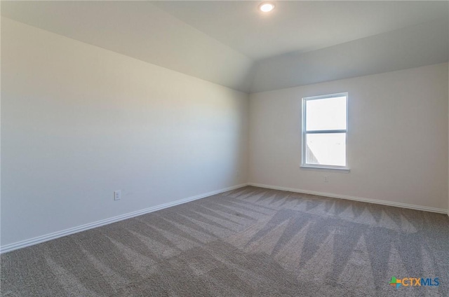3820 Poteet Ct, Temple, TX 76504 - carpeted empty room featuring lofted ceiling and baseboards