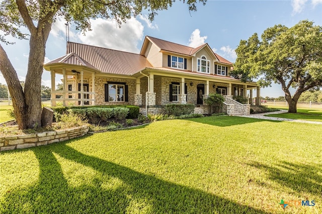 view of front facade with a porch and a front lawn