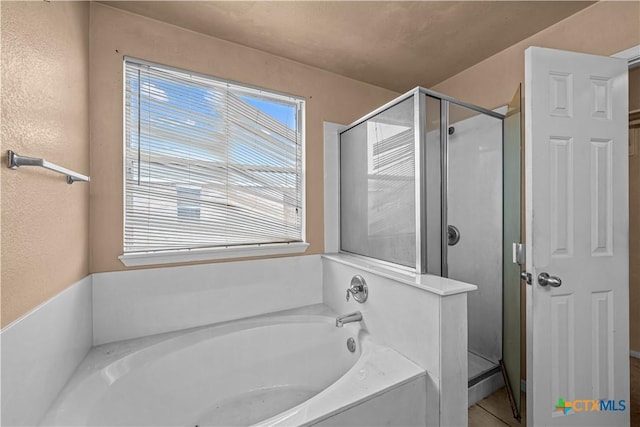 bathroom featuring plus walk in shower