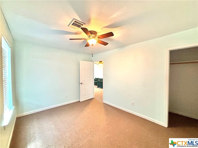 unfurnished bedroom with a closet and ceiling fan