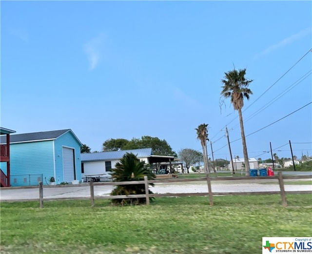 view of yard featuring a garage