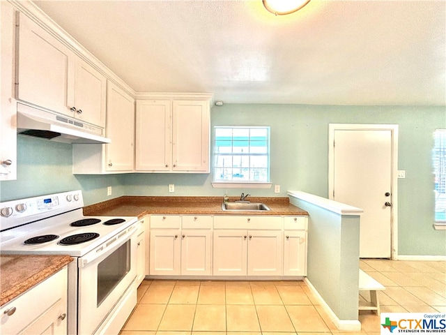 kitchen featuring light tile patterned flooring, white cabinetry, sink, and electric range