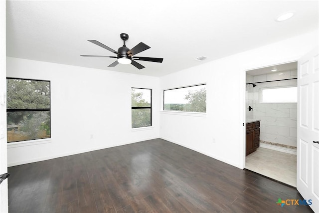 unfurnished bedroom with visible vents, dark wood finished floors, recessed lighting, baseboards, and ceiling fan