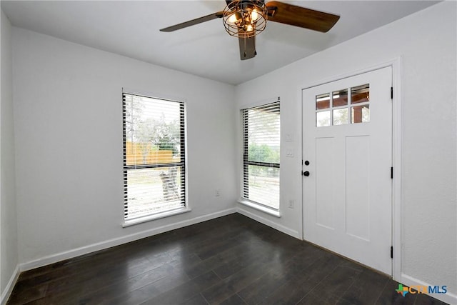 foyer with dark hardwood / wood-style floors and ceiling fan