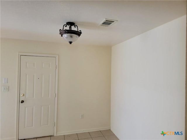 spare room with visible vents and baseboards