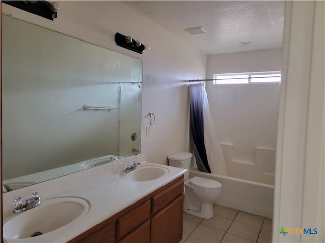 bathroom with shower / bath combo, a sink, toilet, and tile patterned floors