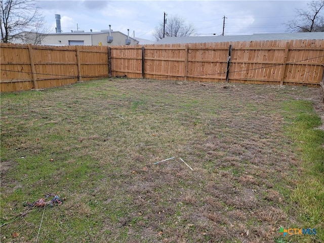 view of yard featuring a fenced backyard