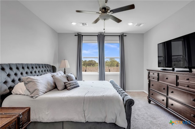 bedroom featuring light colored carpet and ceiling fan