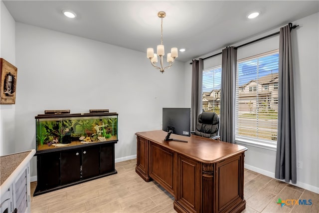 office space with light hardwood / wood-style flooring and a notable chandelier