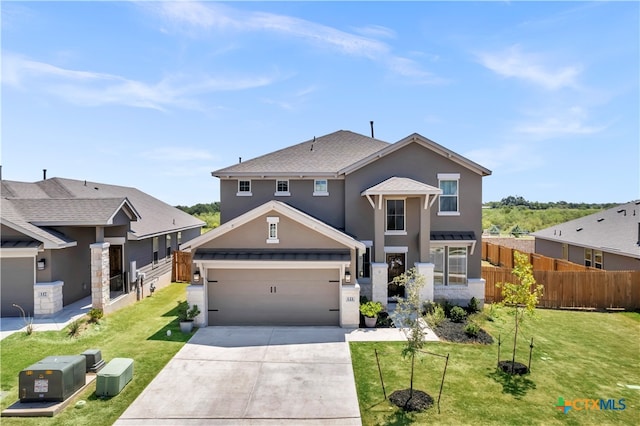 view of front facade featuring a garage and a front yard