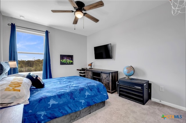 bedroom with light carpet and ceiling fan