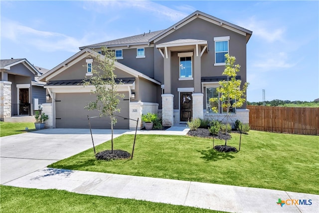 view of front of house featuring a garage and a front yard