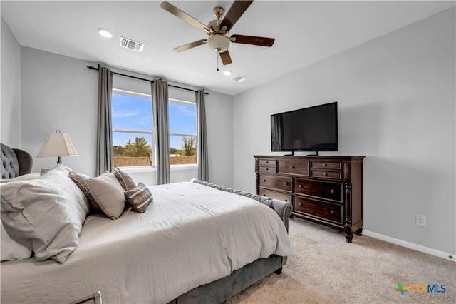 bedroom with light colored carpet and ceiling fan