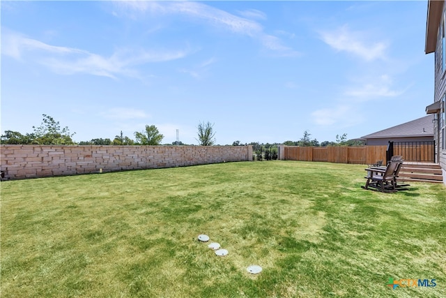 view of yard with a wooden deck