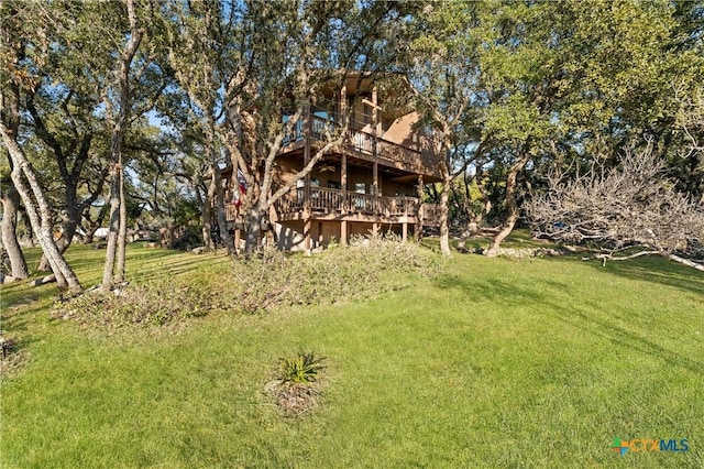 1560 Roadrunner Ln, Canyon Lake, TX 78133 - view of green lawn with a deck