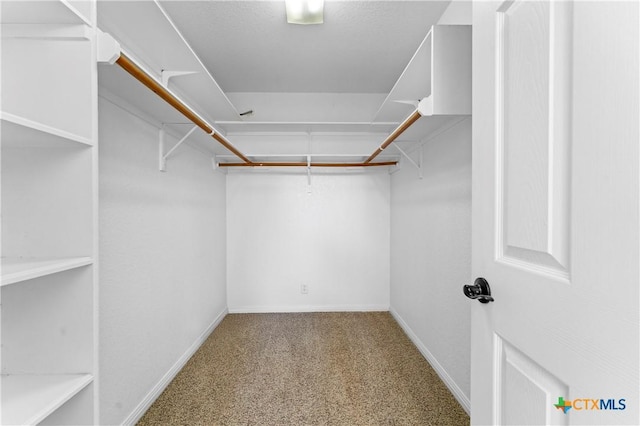 1560 Roadrunner Ln, Canyon Lake, TX 78133 - spacious closet featuring carpet flooring