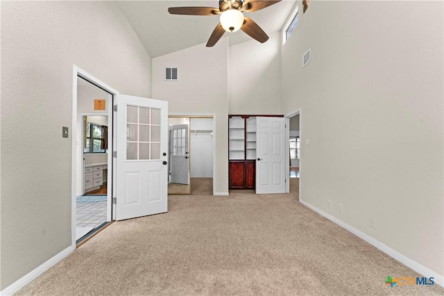 1560 Roadrunner Ln, Canyon Lake, TX 78133 - unfurnished bedroom with carpet flooring, high vaulted ceiling, two closets, and ceiling fan