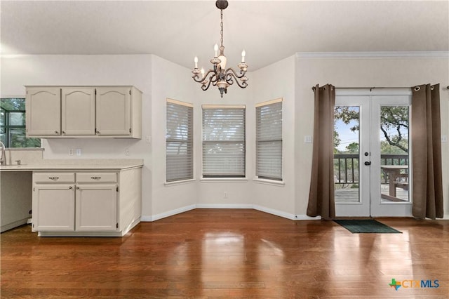 1560 Roadrunner Ln, Canyon Lake, TX 78133 - unfurnished dining area with a chandelier, dark wood finished floors, and french doors