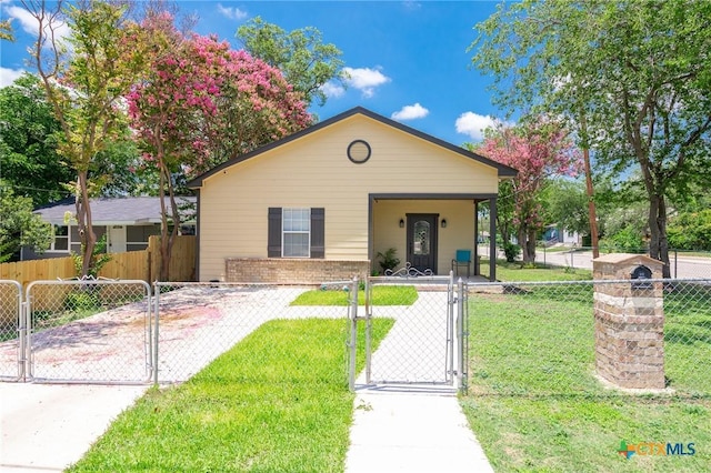 235 Gray St, San Antonio, TX 78208 - bungalow-style home featuring a gate and brick siding