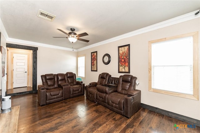 235 Gray St, San Antonio, TX 78208 - living room featuring dark wood-style flooring, crown molding, ceiling fan, and baseboards