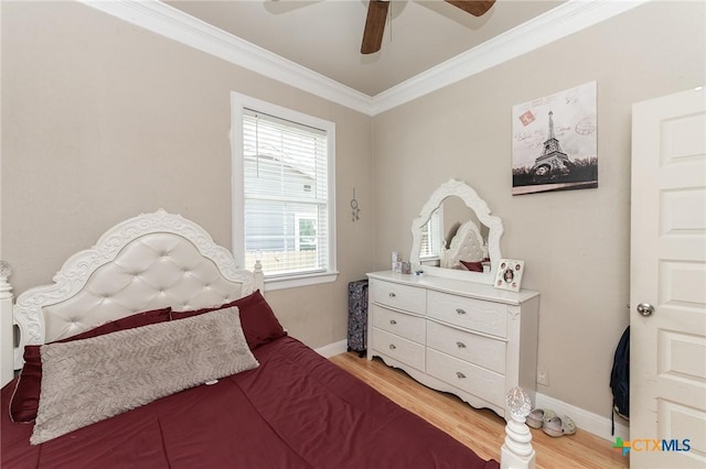 235 Gray St, San Antonio, TX 78208 - bedroom featuring wood finished floors, crown molding, baseboards, and a ceiling fan