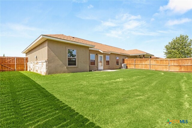 152 Navarro Xing Unit 3B, Seguin, TX 78155 - back of property with a fenced backyard and stucco siding