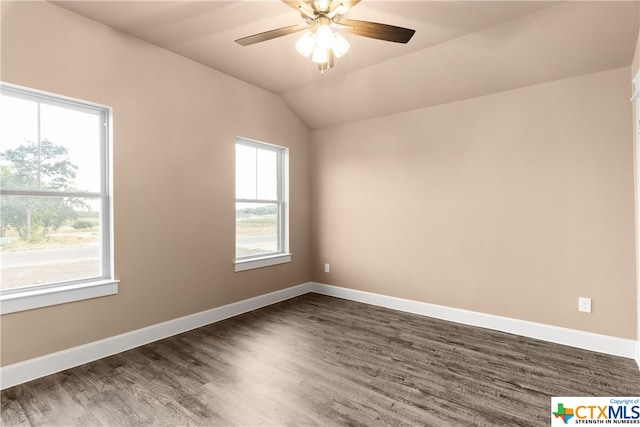 spare room featuring dark hardwood / wood-style flooring, ceiling fan, and lofted ceiling