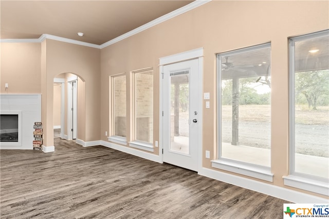 entryway with crown molding and hardwood / wood-style flooring