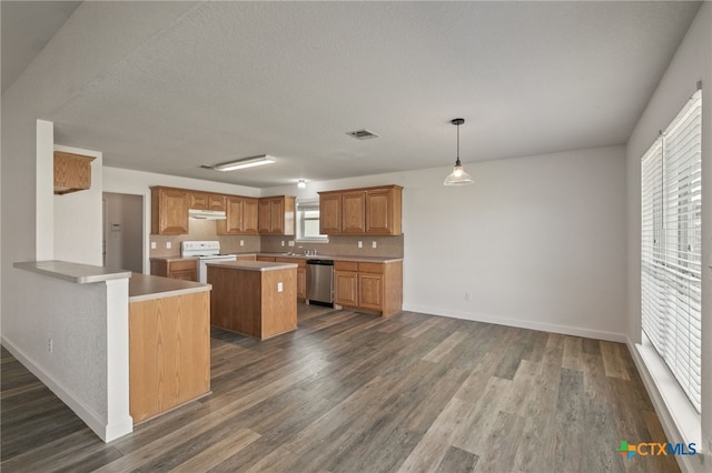 kitchen with visible vents, a center island, stainless steel dishwasher, white electric range, and under cabinet range hood