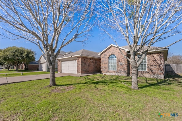 single story home with a front yard and a garage