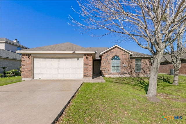 single story home featuring a front lawn and a garage