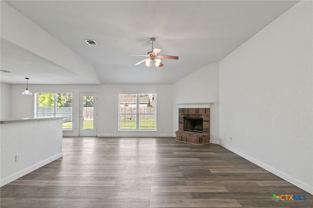 unfurnished living room featuring visible vents, a ceiling fan, baseboards, and lofted ceiling