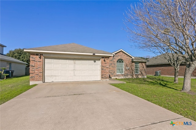 ranch-style home with a garage, a front yard, and central AC